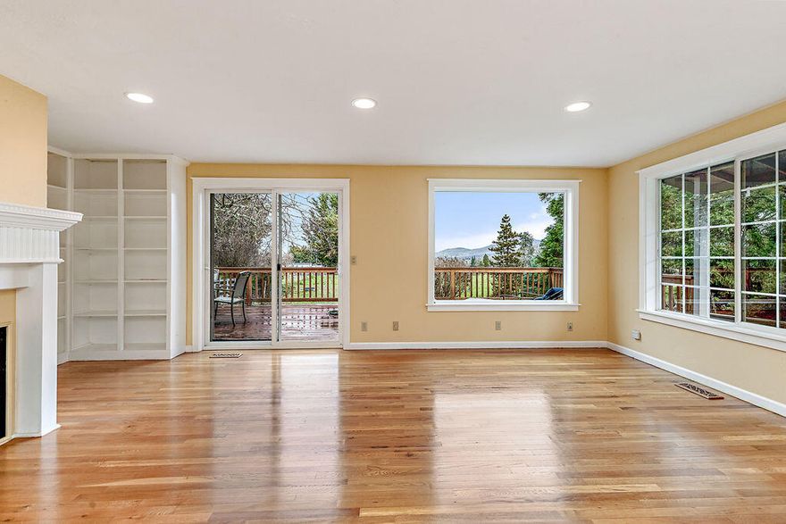 Fantastic close-in mini ranch on 2.49 fully irrigated, flat acres. The home was built in 1980 and has been updated in 1998. Three bedrooms and three baths. Fantastic vistas of the north sections of the Rogue Valley. Solid surface counters, two kitchen sinks, skylights, sub zero refrigerator plus freezer, newer washer and dryer, riding mower, hardwood floors, lots of natural light, large deck overlooking the valley, fenced and cross fenced, natural gas fireplace, water heater and cooktop. Roof installed in 2007, excellent well per the owner. The home is hooked up to the public sewer system. Large two car garage with additional storage. Large conifers, many fruit trees, all irrigated plus excellent well. Irrigation pump and valves and some equipment in place. Mature landscaping throughout the property. Come view this hard to find property soon. The property is accessed via a flag driveway allowing for privacy.