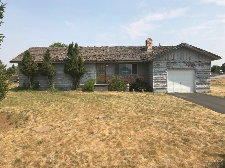 Prime location on the edge of beautiful Bend, Oregon. Lot is flat, has irrigation and mountain views. Remodel the existing home or build your own dream home. Opportunity awaits!!Consult with Deschutes County Development to discuss your dreams.