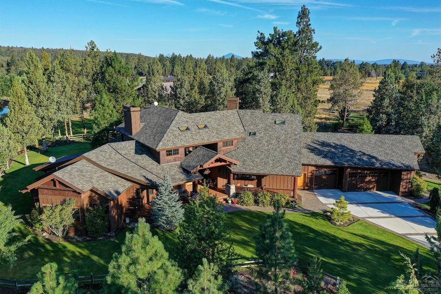 Prime location in Tumalo, peaceful and private, with views of the Cascade Mountains. This extraordinary home, built by Sun Forest Construction, is sited on 5.23 acres, treed and fenced, with underground irrigation. The Northwest design has ranch and log accents, and many quality features. The light filled great room has a majestic stone fireplace and a wall of windows looking over the rear deck and landscaped yard. Perfect for entertaining and family gatherings, the adjoining dining area has a buffet and is open to the spacious kitchen, which features a wall fireplace, large island, breakfast bar and pantry . There is good separation of the master suite, and the guest suite and den, all on the main level. Upstairs, the large loft provides a comfortable space for relaxing. A third guest suite and small office are also up. The large 3-car garage has lots of storage. The barn is extra special, with 3 horse stalls, storage and an office, plus an outdoor corral. Truly a special property!