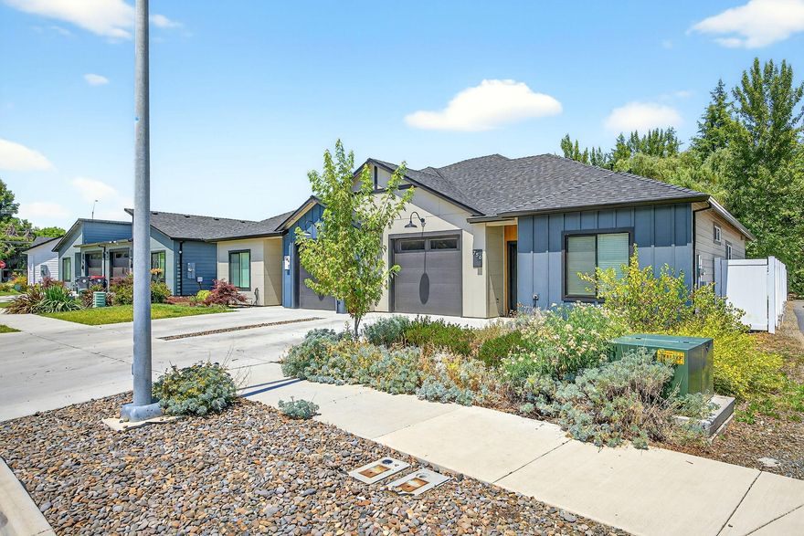 This beautiful home is just like new and move-in ready.  Built by Rispoli Design in 2021, a well thought out open concept floor plan using the square footage well.  The kitchen has an island, eating bar, stainless steel appliances, 5 burner gas range, quartz counters, pantry and white soft close cabinets through out.  All appliances stay with the home, including the washer anf dryer.  The kitchen, dining area and living room flow together with a slider to the backyard.  The bedrooms are of good size, two full bathrooms, convenientr laundry area (washer and dryer stay with the home), very nice vinyl plank flooring in the living areas, artificial  turf in the fenced back yard with a patio for BBQ's or just relaxing.  You'll have to hurry to tour this property.