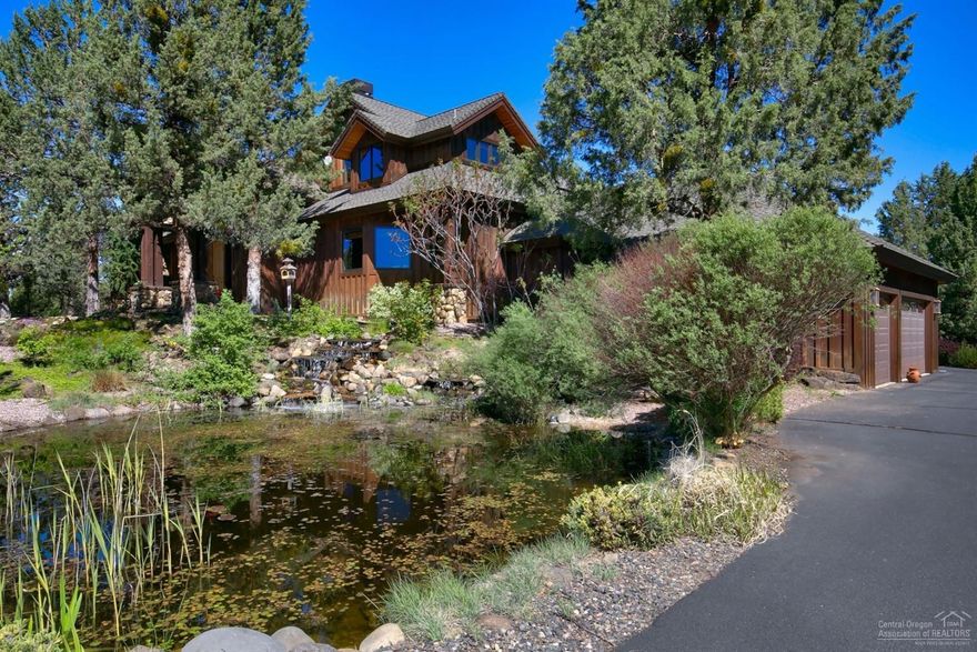 Northwest Style home on 10 acres located minutes from Bend. Custom Home Features: 3007 sf 3 bedrooms, 2 bathroom, gourmet kitchen, formal dining, wood burning stone fireplace, vaulted ceilings, wood and stone floors, office, main level master suite, radiant floor heat, paver patios for outdoor living and attached 3 car garage. Property: landscaped yard, water feature w/ falls, pond, 3 bay shop/RV Storage, 2 stall Barn with tack room, fenced livestock area, private setting and Cascade Mountain Views.