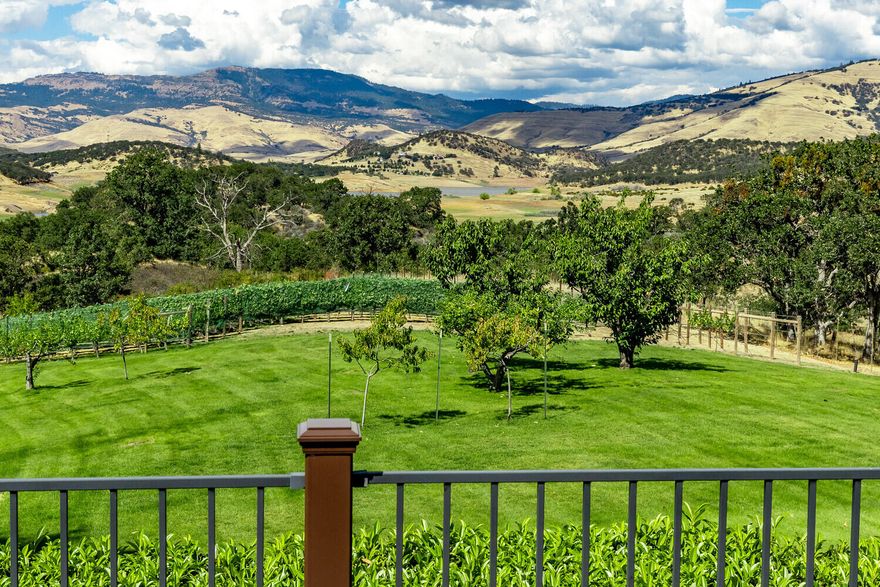 Beautiful views of Emigrant Lake and the surrounding mountains from this perfectly maintained, private, one level home.  This is the builders personal residence and every detail was considered.  Fantastic, open floor plan with high ceilings, generous room sizes, lots of glass, abundant natural light, and high quality amenities.  Island kitchen with walk-in pantry, granite counters, skylights and newer appliances. 
The large, wrap around Trex deck is ideal for entertaining.  The private driveway is paved and has plenty of parking space.   TID irrigation on timed sprinklers.  50 year composition roof.  Hardie Plank siding and Sierra Pacific windows.  The well has a new pump and a new 2,000 gallon holding tank with a whole house UV water purifying system.  There is a 3 zoned heating and cooling system with an auxilary heating unit.  Sand filter septic system.  There is a small hobby vineyard with 350+ grape vines.  Oversized, 3 car garage with half bath and full overhead storage.