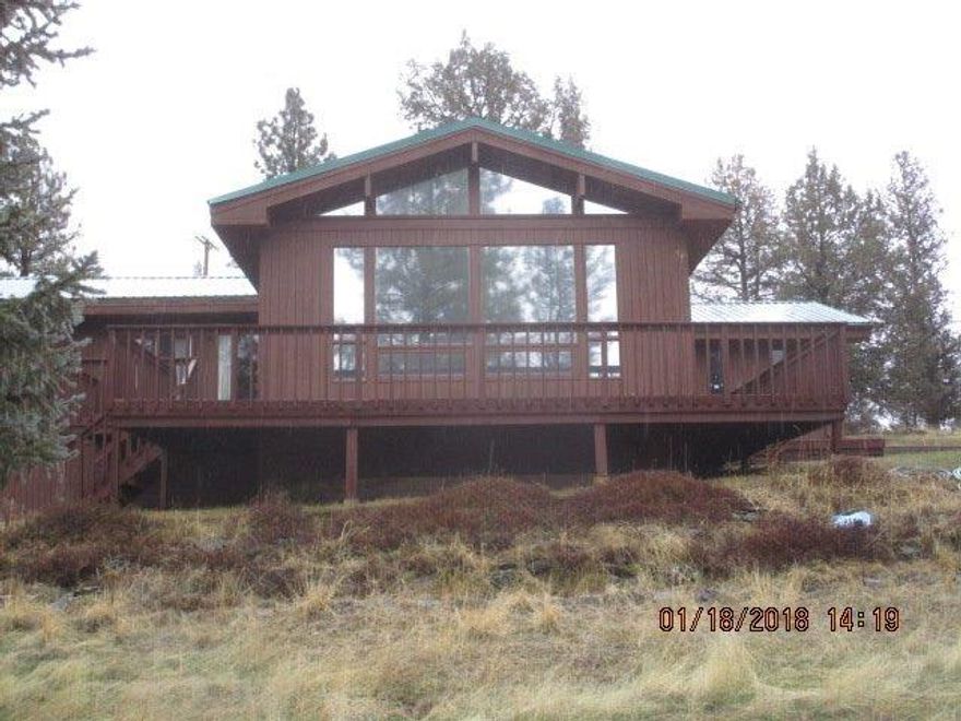 This is a one-of-a-kind home situated on a knoll with no neighbors! The property is surrounded by farm fields an the knoll had tall ponderosa trees for privacy. This custom home is dated, but shows well and shows quality workmanship throughout. The finished basement has a walk-out door and the 486 sq.ft. of living space is not included in the main home's living area. This is truly a rare find and so close to town.