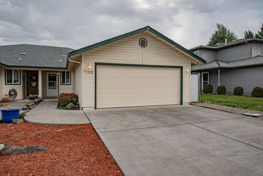 Well-maintained home located in a wonderful Central Point neighborhood. This move in ready home features 2 large bedrooms, 2 full bathrooms with 1,076 sqft. Large open kitchen with breakfast bar, pantry, plenty of cabinets and counter space. Open floor plan with dining area and family room with slider leading to the covered patio and nice size fenced backyard with sprinklers. Primary suite located in back of home. New interior paint and wood laminate flooring throughout living space. Attached two car garage.