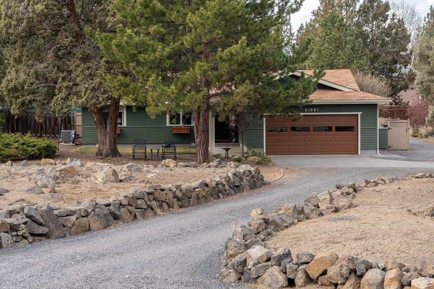 You'll fall in love with this beautiful single story home and it's private park like setting perfect for indoor/outdoor living!  Featuring a wonderful living area with new woodstove and vaulted beamed ceiling, gorgeous kitchen and dining area with oversized slider leading out to the gazebo covered deck and patio offering endless entertaining opportunities.  Spacious vaulted primary bedroom with private bath and slider to patio, 2 additional bedrooms and full bath. Laundry room with plenty of storage, oversized 2 car garage with workbench.  Hardwood flooring at entry and dining area with tongue & groove wood accents.  Located on a .70 acre private lot w/ carport canopy, 2 storage sheds, and plenty of room to bring your RV, boat or toys!  Conveniently located to parks, nature trails, shopping, local eats and more! Enjoy watching the 4th of July fireworks from your front yard!  In excellent condition, this home is a rare find!