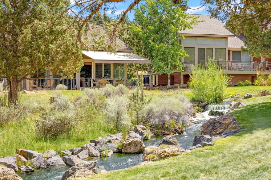 Come experience all that Eagle Crest has to offer from this remarkable single level end-unit townhome ON THE CREEK. This comfortable TURNKEY retreat is filled with natural light with expansive floor-to-ceiling windows and sliding glass doors to the spacious ground level paver patio offering a tranquil setting and beautiful views of the creek and waterfall. Featuring upgraded easy maintenance flooring and a retractable awning to provide cover from the Central Oregon sunshine. The thoughtfully designed space offers two bedrooms and two bathrooms with great indoor/outdoor living for entertaining. A wonderful primary residence, second home or income producing vacation rental. Ideally located close to the Lakeside Sports Center, Cline Buttes trail system and paved biking paths. Eagle Crest resort is home to three 18-hole golf courses, three sports centers, indoor and outdoor pools, day spa, restaurants, market and miles of trails. A perfect basecamp for the best of Central Oregon living!