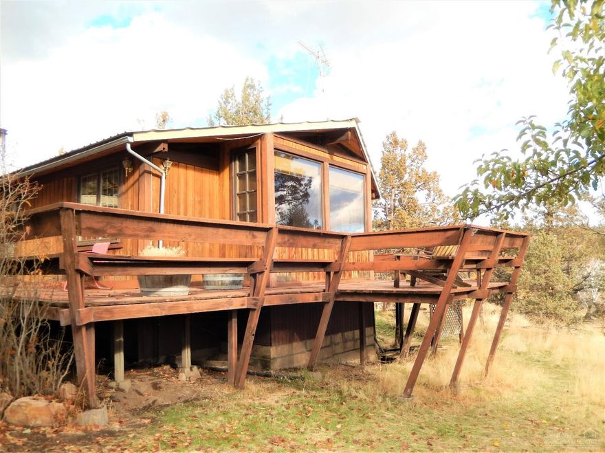 Rustic cabin in a peaceful location. 3 bedrooms and 2 baths with a wrap around porch. Has a workshop, detached garage and fenced yard. Enjoy the amenities of Ochoco West including swimming, community hall, fishing, shooting range and BLM hiking trails nearby.