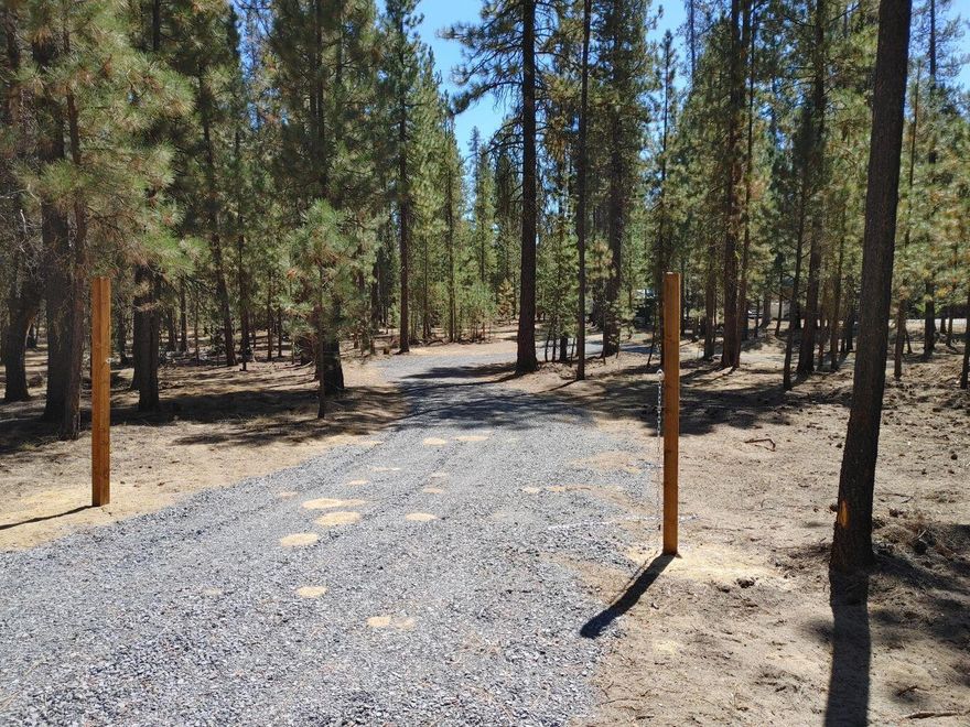 Looking for a lot to Build your Dream home,shop,or vacation getaway, nestled in the pines. This property is build ready! The entire property has had a pine needle & pine cones, removed, all brush, sucker trees, and bitterbrush have been removed. Fire safe. A brand new ATT septic system has been installed. 200 amp service installed, full RV hook up with 50 amp power, also 110 outlets and RV dump connection, water hydrant with back flow installed with supply for future home connection, and More!!