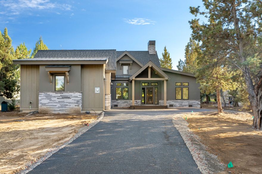 Stunning brand new single-level home located in one of Eagle Crest's exclusive gated communities. 
This custom-built home showcases soaring vaulted ceilings that flood the space with natural light. 
Expansive gourmet kitchen anchored by a large natural stone quartzite island complete with a wine fridge. 
The primary suite features a free-standing soaking tub, separate walk-in shower, and spacious walk-in closet.
Two guest rooms; one with en-suite bathroom, additional full bath, and a dedicated office for work-from-home convenience. The expansive laundry room comes complete with a premium washer and dryer.
Step outside to your private covered cobblestone patio featuring a custom fire pit, perfect for entertaining while overlooking the 12th tee of the Resort Course. 
The exterior blends composition and metal roofing with cultured stone and hand-applied stucco accents. The oversized triple car garage with 9ft doors includes an electric vehicle charger to complete this luxury home.