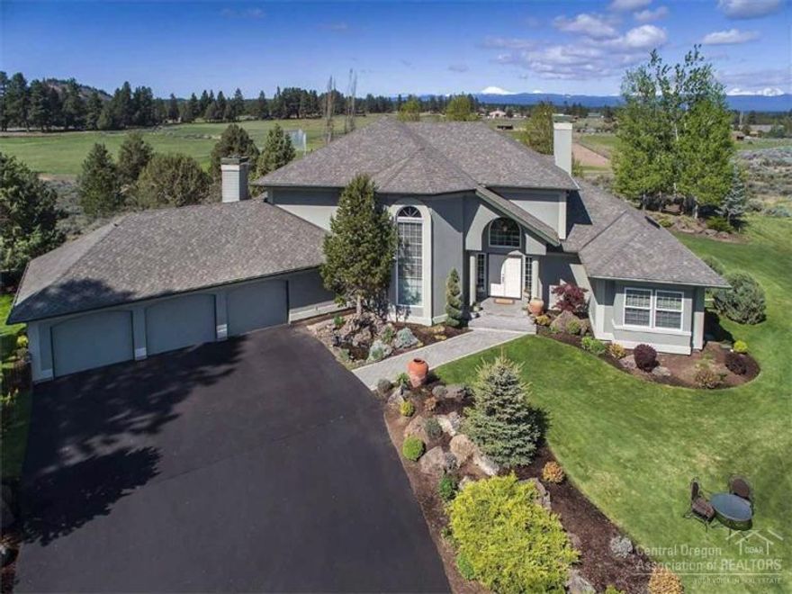Spectacular gated Country Estate boasts panoramic views of the Cascade Mountains & Ochocos. Spacious living room with a propane fireplace. Gourmet kitchen, Family room, Media room, Formal Dining & Office. Beautifully landscaped yard with a tiered cascading waterfall. Cottage w/large living area. 1,200 sq. ft. heated workshop with 10' ceilings & roll-up doors. RV parking w/power. Boat, swim or fish for bass in the pond. Enjoy hiking/biking trails. Fenced 9 acre pasture with underground automatic irrigation.