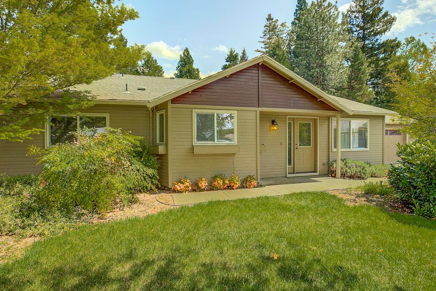 Charming updated home in a great location.  Move – in ready, meticulously maintained 1756 square feet, 3 bedroom, 2 bath, located at the end of a cul-de-sac on a quiet, tree lined street.  Updated wood flooring in kitchen and living rooms with vaulted ceilings.  Kitchen offers extra-large pantry, and double door refrigerator with water and ice.  Open concept, split floor plan is perfect for entertaining.  Large private master suite offers walk-in closet and en-suite bath includes a tub.  Glass doors open onto peaceful backyard garden and patio.  Patio is wired for a hot tub.  Beautiful mountain views from backyard and master bedroom.  Professionally landscaped yard has automatic irrigation system installed.  Attached two car garage includes a work bench and cabinets, additional parking with room for an RV or boat.  Located in the Griffin Creek school district.