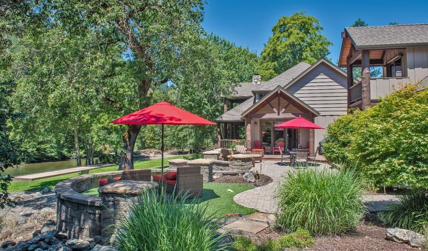 Heart of Southern Oregon Wine Country w/ Applegate River frontage! Gorgeous private gated entry w/ a Vineyard, over 1600 vines, fenced pasture area & fully irrigated w/ in-ground system. Stunning Lodge style home + 600 sq ft cabin, 4+ Car garage & shop. Lg open wood vaulted beam ceilings w/ floor to ceiling windows & doors! Dream kitchen w/ dbl ovens, 2 islands, wolf 6 burner gas cook top w/ convection oven, sub zero refrige, 2 dishwashers, 2 sinks, granite counters, skylights, walk in pantry w/ 2nd refrige. Breakfast rm off kitchen w/ wall of glass & doors to back deck. Formal dining rm w/ temperature controlled wine rm. Great rm w/ lg stone floor to ceiling wood burning fireplace, open office area / den w/built ins. Master ste on main floor w/ 2nd wood burning fireplace, River views, 2 walkin closets, 2 vanity sinks, soaking tub, lg walk in tile shower w/ duel heads. Upper lg family rm or 4th bdrm w/bathroom & covered balcony. Park like grounds w/ Gazebo, Fire pit & garden beds.