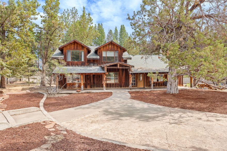 Set on 4.71 acres, this property offers not one but TWO separate homes—perfect for multi-generational living or rental income potential. The main home, built in 1990, welcomes you with a charming covered porch and features a spacious kitchen, dining area, living room, 3 bedrooms, 2 full baths, plus a master suite with walk-in closet and bonus loft. The second home, built in 2004, showcases an expansive front deck, open floor plan, large primary suite, full kitchen, guest bath, and a 3-car garage with office and ample storage. Outside, enjoy a chicken coop, garden area, basketball court, and an additional 870 sqft garage/shop—plenty of room for animals, hobbies, and toys. Conveniently located between Bend and Sisters, just minutes from the Sisters Rodeo Grounds, this property offers endless possibilities and country living at its best!