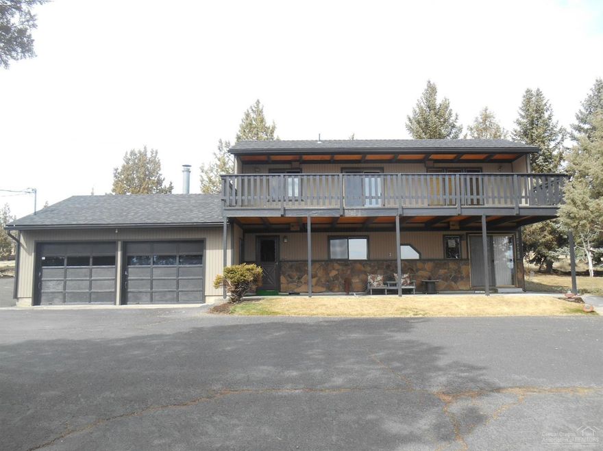 Value is in the land. Zoned for housing in growing Madras. Nice gentle slope. On quiet Belmont Ln. Enough land for over 60 homes! The house that goes with the land is very nice. Open floor plan and the house has some style. Nice garage/shop and lean to. This is a developers dream. Value of lots and houses are rising rapidly and there is a demand.