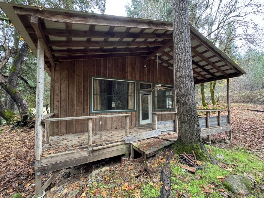 Extremely rare property! This over 80ac parcel with frontage to Grave Creek has tons of history. It was once a functioning mine with Historic Gold Deposits. It has a small cabin with large storage area. Power is to the property and options are endless. Many ponds throughout the property, tons of crisscrossing internal roads for access. Make this unique property your own.