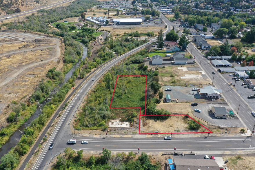 Prime Development Opportunity in Phoenix's City Center District! Exceptional .71-acre property comprised of two tax lots, offering outstanding potential in a high-visibility location. All utilities—water, sewer, electric, and phone—are underground at the property line and ready for connection. Situated within Phoenix's thriving downtown corridor, this site provides excellent accessibility to I-5, Hwy 99, and public transportation. Surrounded by new development projects, it's ideally suited for investors, developers, or business owners looking to capitalize on this prime location. Perfect for a mixed-use project in one of the area's fastest-growing markets!