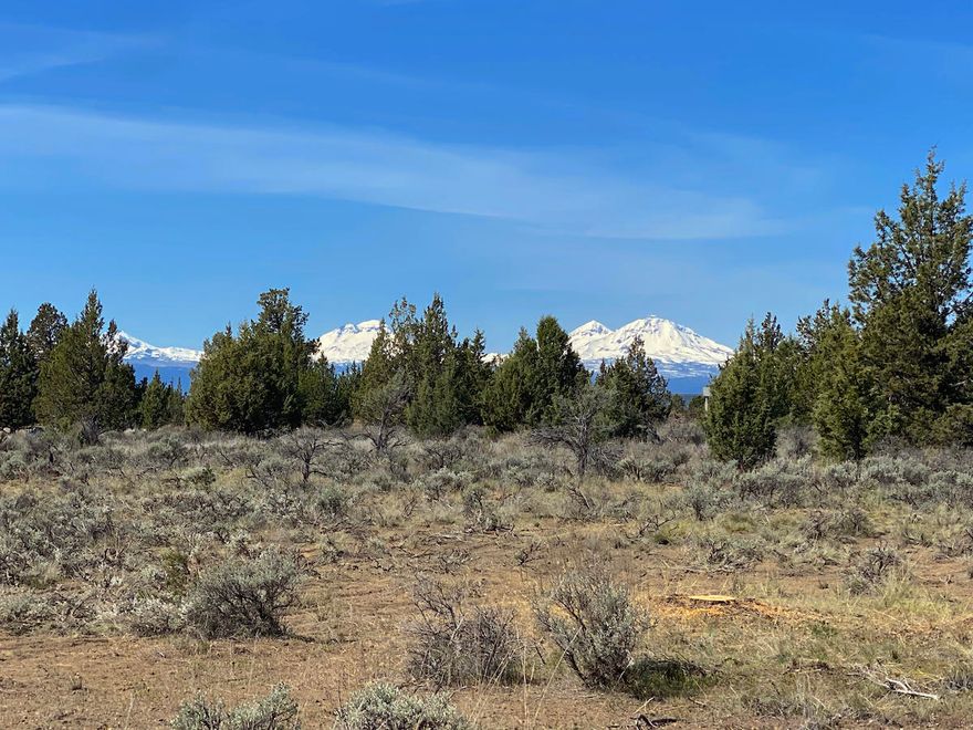 Motivated seller!! This lot has it all! Lovely views of the Three Sisters and Broken Top framed in old-growth juniper trees from the ideal home site which sits towards the back of the property in a natural clearing. Seller has cleared some additional trees to open up the view which can be enjoyed from a single level home or build two stories for nearly panoramic views! Close to the new Ranch rear exit, this flat 4.87 acre parcel sits up on the southwestern most Ranch mesa. Property has been septic approved, power is partially up the lot line, and surrounding well depths are 300-350ft. Plenty of room for your shop, toys, barn, and animals. Enjoy fishing at Steelhead Falls, swimming in the community pool, a day on the beautiful golf course or one of the many other amenities Crooked River Ranch has to offer!