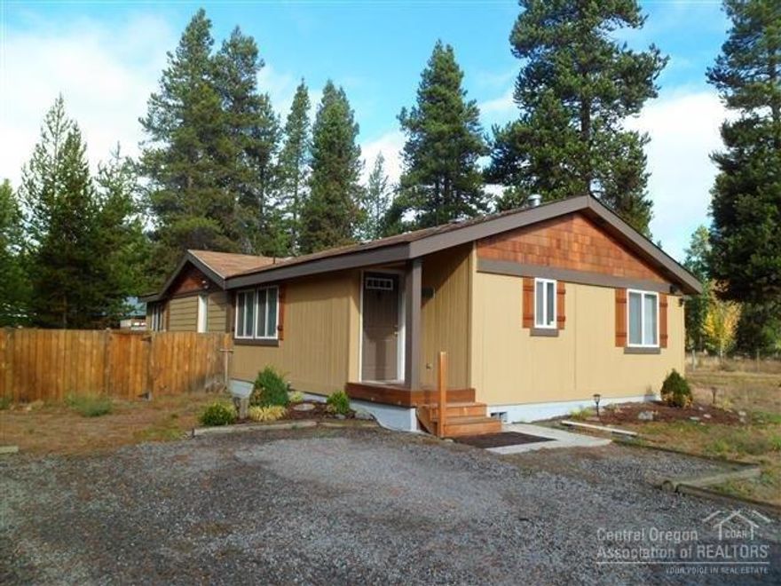 Home sweet Home! Lovely property located on paved road - Serene back yard patio with hot tub. GARAGES! Why have only 1 garage when you can have 2? Acre plus with Aspen trees throughout and fenced on 3 sides. Plus a little hobby house or perfect man cave. A must see!!