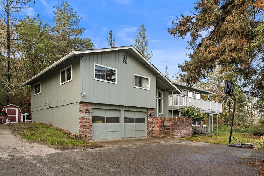 Beautiful City and mountain views from the deck of this 4 bedroom, 3 bath home with approximately 2944 sf. Newer exterior paint, carpet and windows have been updated and is waiting for you to enjoy. Great room with brick fireplace and an abundance of windows to bring in the natural light; kitchen with slider to the deck and formal dining room. Nice laundry room with storage cabinets. Downstairs family room is great for entertaining family and friends; brick fireplace and slider to the patio. An attached two car garage and storage shed. A ramp is there for handicap access. An abundance of wildlife to enjoy. Convenient location; close to shopping, hospital and District 7 schools. This may be the home you're looking for.