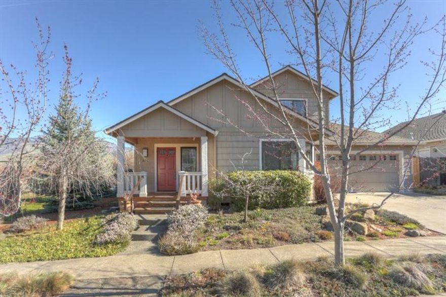 Spaciousness, light, and views earmark this home which sits tidily on a quiet street in a very desirable neighborhood. The front porch for sitting or greeting neighbors leads into an attractive foyer with room to store coats and shoes. There are many special touches throughout: walnut beams in the dining room, walnut trim on the windows, a built in walnut tv console and a small wet bar by the kitchen. There is a brick wood burning fireplace for cozy evenings and heated tile in the bonus/sunroom. The living room ceiling is vaulted and leads out to the back patio for outdoor dining /barbecuing in summer. The laundry room has built in storage and a sink. The master suite is upstairs and looks out onto Mount Ashland. A deep Jacuzzi tub and walk in shower grace this large bathroom. The fenced backyard and pretty front is landscaped simply and elegantly. This Steve Asher built home is an unbeatable find and close to downtown.