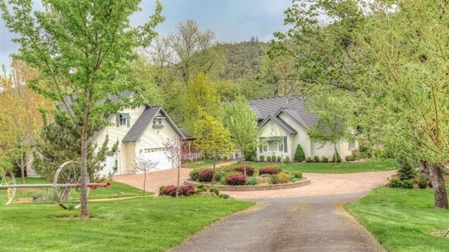 Captivating views bring the outdoors in on this beautifully treed 3.1 ac. w/256' of premier Rogue River frontage. Enjoy living on your own private sanctuary w/over 1/3 mi. walking paths, fruit trees, herb garden, circular driveway & huge R.V. parking w/hookups. One of the most stunning homes in the valley w/unparalleled quality, master craftsmanship & brilliant use of architectural design & detail throughout. Expansive floor to ceiling windows & 20' vaulted ceilings, hardwood floors, w/gas fireplace in the open living/dining area. Large mstr.suite w/pedestal bathtub, his/her vanity's, huge walk-in shower,& private river-view deck. Kitchen is a designers dream, beautiful cabinetry, gorgeous granite, Heartland vintage refrigerator and gas stove/cook top. Wonderful loft area w/2 suites upstairs. Beautiful artists studio or office. w/Waterford wood-stove above the 3 car gar.Separate river front tax lot 1.44 ac. included