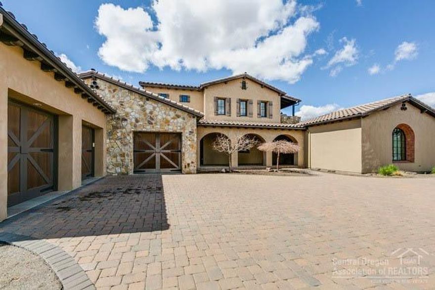 Behold this grand timeless home at Pronghorn Resort. Built in 2007 with the very best materials. An open floor plan with lavish kitchen with an oversized island and breakfast bar. The living room boasts a spectacular floor to ceiling fireplace. French doors open to a magnificent court yard which allows entry into an additional guest suite. The separate media room is off of the kitchen. The master bedroom and office are on the main floor. Two extra bedrooms, a bonus room and a laundry room are upstairs. Premier membership deposit included in the price.
