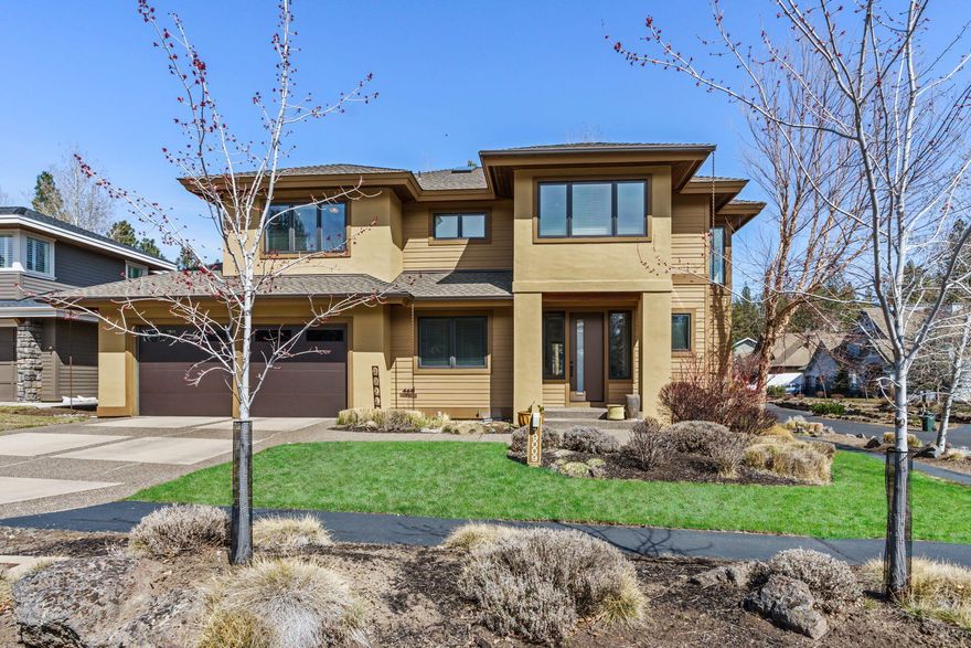 Modern elegance abounds in this meticulously maintained and light filled 4 bedroom, two and half bath, 2531 sq. ft. home. Located in the much sought after neighborhood of Three Pines, this two story open floor plan features the primary en suite on the main floor with updated carpet and custom closet system. Updated lighting throughout, maple hardwood in the great room, gourmet kitchen with glass mosaic backsplash, Pental quartz counter tops, new kitchen sink and faucet, GE SS gas range, GE refrigerator, and GE dishwasher. Other upgrades include; exterior paint, fiberglass entry door, the second floor has all new carpet, and the home has been wired for sound. Homeowners will enjoy the serene park and pond setting from their large patio the seller upgraded with pavers and enlarged to create an expansive outdoor living space. Conveniently located within walking distance to Shevlin Park, this amazing property situated on a corner lot offers the very best of the Bend lifestyle!