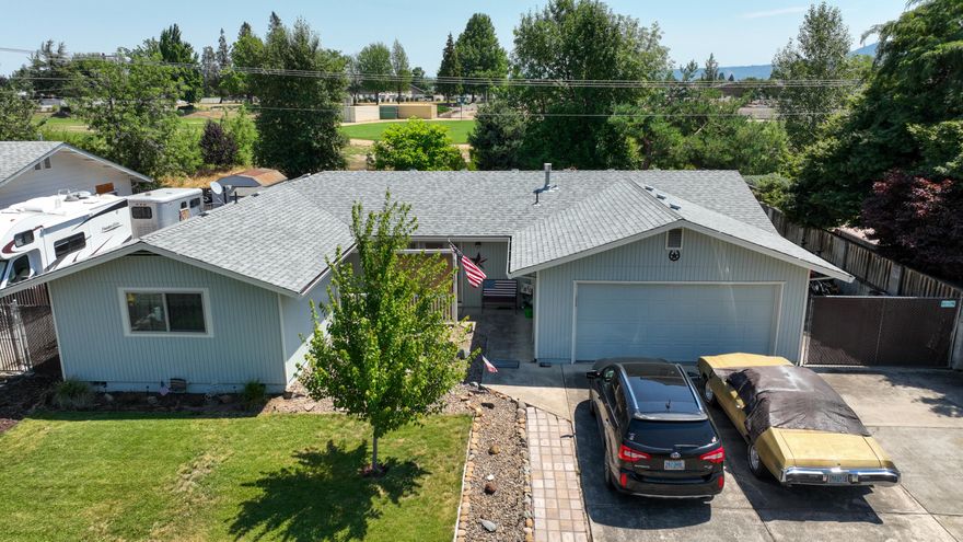 Turn key ready home with all the updates! Newer paint inside and out with large open floor plan with beautiful open kitchen! New laminate flooring compliments the modern touch. Boat, rv parking on the side of home. Large backyard all fenced with creek behind it.  Shed and patio.  This charmer is minutes to conveniences and interstate 5. Centrally located and well kept. This one is ready to be sold to you!