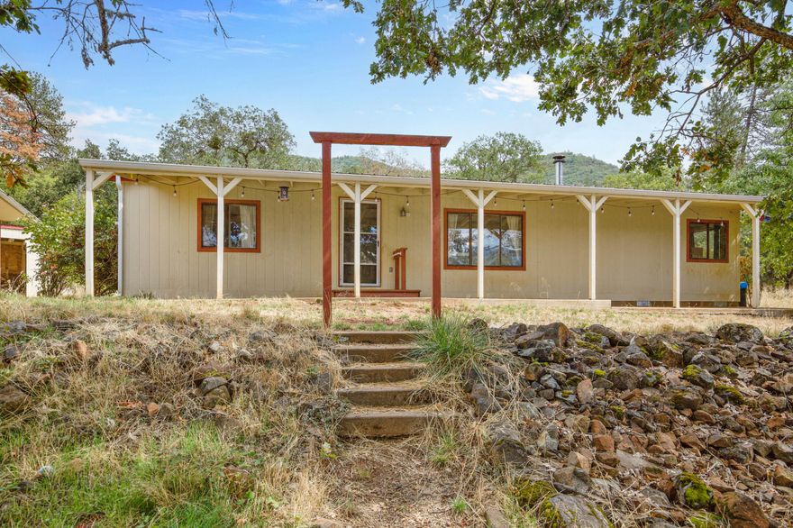 A rare opportunity—this large 5-acre property offers space, privacy, and an assumable loan at just 4.625% to give you a major advantage in today's market.

The 3-bedroom, 2-bath home comes with a covered front porch, while the oversized 2-car garage (with 220 power) includes a bonus space complete with its own bathroom and shower—perfect for guests, hobbies, or a home office.

Outdoors, enjoy flat, usable land with fruit trees, garden space, fencing, and outbuildings. Wildlife is a frequent visitor, adding to the peaceful country setting, and the property features a level field ideal for animals, gardening, or future projects. Per seller, a strong well serves the property.

With unbeatable financing and endless potential, this property is ready for your vision.