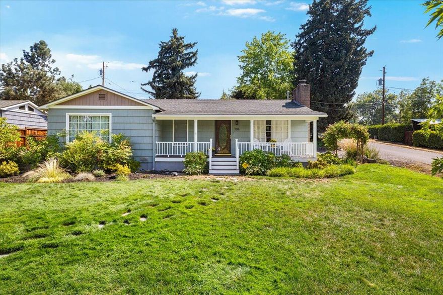 One of the most incredible locations in old East Medford, close to Rogue Valley Country Club, blending timeless character with modern upgrades. Nearly fully remodeled 4 bedroom, 2 bath home on a .26 acre corner lot with mature trees, striking curb appeal, and rare privacy. Major upgrades include Bryant HVAC (2022) and new roof and gutters (2023). Features refinished oak hardwood floors, newer fixtures, wood-burning fireplace, custom paint, and a great floor plan. The updated kitchen offers quartz counters, marble backsplash, custom alder cabinets, farm sink, pantry, and upgraded stainless appliances. Primary suite has two closets and remodeled bath with walk-in tile shower, linen cubby, and designer finishes. Hall bath features quartz vanity, wainscoting, tile surround, and luxury vinyl. Some newer vinyl windows. A truly special East Medford home with style, charm, and privacy. MUST TOUR!