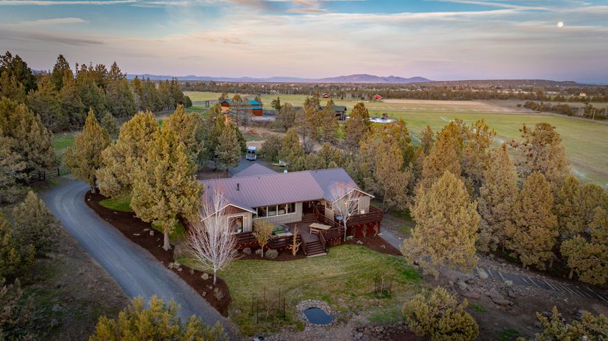 Cascade Mountain and pastoral views are the backdrop for this 10 acre turnkey horse property & hobby farm. Situated in a valley enjoy both sunrises over Powell Butte in the and stunning sunsets behind the Cascades. Inside this light and bright home is an open concept floor plan with thoughtful separation between the guest bedrooms and the recently added spacious primary suite. Enjoy views of Broken Top & the Three Sisters from almost every room. The just completed pantry is an natural extension of the kitchen with butcher block counters & an abundance of custom cabinets. You will spend a good deal of your time outdoors on this property, either by the fire pit as the sun sets, sitting overlooking the horses grazing or riding in the arena. The barn, remodeled in 2022, has 4 tongue in groove stalls with runs, automatic waterers, grooming stall & heated tack room with a full bathroom. All irrigation is all underground including the arena. See full details in the attached features sheet.