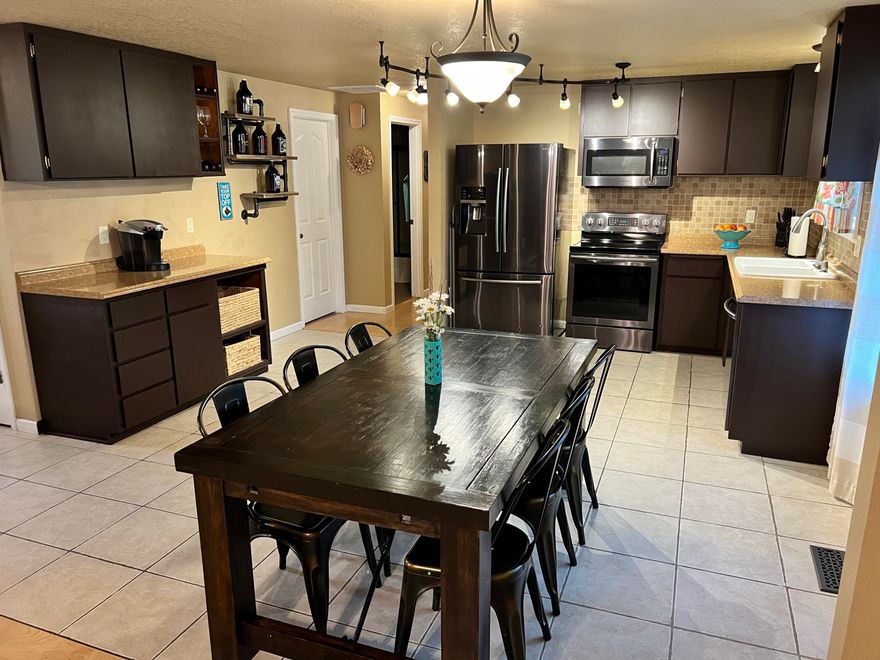 This inviting single level boasts a spacious kitchen and open concept living. Plenty of enhancements throughout this home give a great overall feel. Features include updated appliance package, tile shower w/ frameless door in primary bath, forced air heating and cooling, private rear yard with hot tub, garage/storage with plenty of space for your toys and RV pad with electric/sewer. Central location of this corner lot gives you easy access to all of Bend. Schedule your visit today!