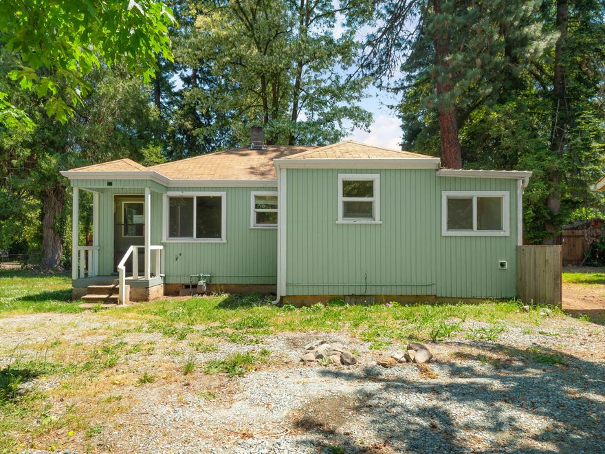 Reasonably well maintained home on an attractive setting on a quiet, non through street within walking distance of the casino. Previous updates appear to have been performed to the bathroom & vinyl windows. Attractive built ins. Converted garage to shop / outbuilding has a bonus room with drywall and floors. See Instructions.