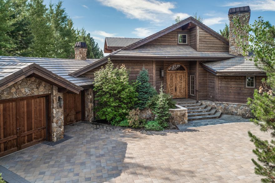 Welcome to this exquisite home, situated on .6 acres across from the waterfall on the 13th fairway of the award winning Nicklaus course. The details and finishes in this home are truly unparalleled, starting with the crushed marble Venitian plaster throughout the home, hand scraped oak wood floors, private decks from each bedroom made of Hoduran Mahogany, accent shutters in the kitchen are 700 years old from the Nouristan valley in Afghanistan, the fireplace mantel is handcrafted from reclaimed Ash by an artist in Sante Fe, this home is a site to behold. A beautiful entry welcomes you in to the great room with large chef's kitchen (professional grade Wolf and Bosch appliances), handsome gas fireplace and large eating area, master suit on the main with generous walk-in closet, soaking tub, also on the main is a music area, media room and ensued bedroom. With 4,258 sq ft, 3 bedrooms and 4 and half bathrooms and over 1,200sq ft of outdoor living space you will not find its equal