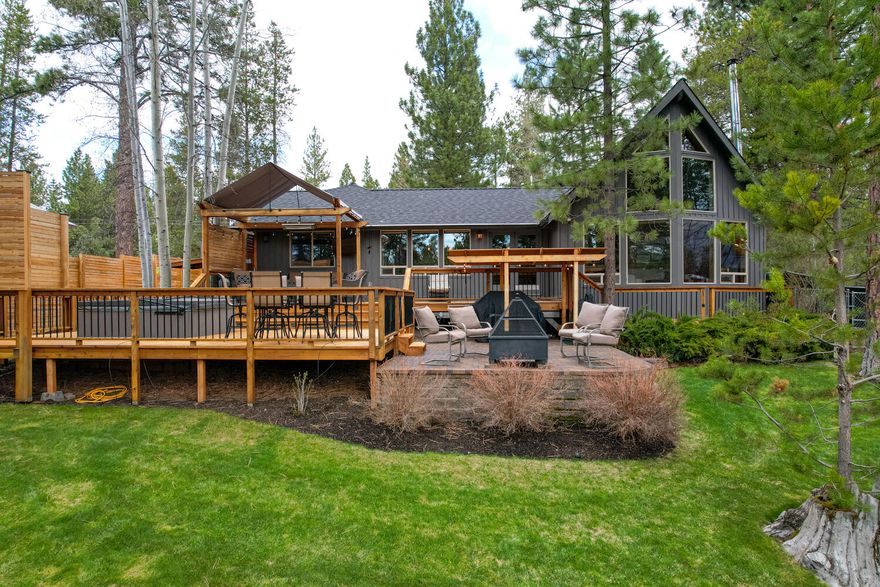 Welcome home to your own waterfront retreat! Incredible park setting with beautiful abundant Aspens and Ponderosa Pines, water views, lush green grass, private dock.. outdoor living at its best! Gorgeous multilevel deck with lots of sitting areas, hot tub with privacy. This 4 bedroom 3 bath home lives large with 2 primary suits (one on main level and one upstairs), wonderful open floor plan that flows nicely for indoor/outdoor entertaining. Open and bright with plenty of room for friends and family.  Neighborhood offers private marina, walking trails, winter road maintenance all with easy access to mecca of outdoor fun! Sunriver Village, golf, breweries, coffee, shopping all minutes away. What the current owners love is having a boat dock in the back yard for immediate access to the river for an evening cocktail cruise or fly fishing on one of the best rivers in the northwest. Delicious piece of paradise that is a rare find. It's time to make this dream a reality!