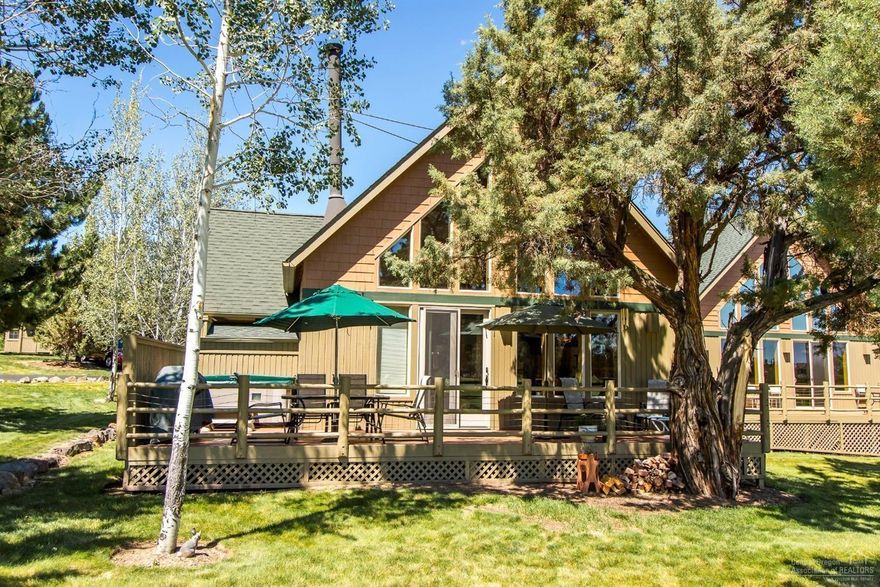 Chalet-style home with direct view of the Ridge Golf Course in Eagle Crest. T&G knotty pine wall and ceiling surfaces along with log structural members, staircase balustrade and loft railing establish a charmingly rustic feel. Double-tier windows in the two-story great room and a full-width deck face the golf course. Corner wood-burning fireplace. Galley style kitchen w/ pass-through to breakfast bar w/ raised eating surface. Master suite has jetted tub. Hot tub included. Electric heat pump.