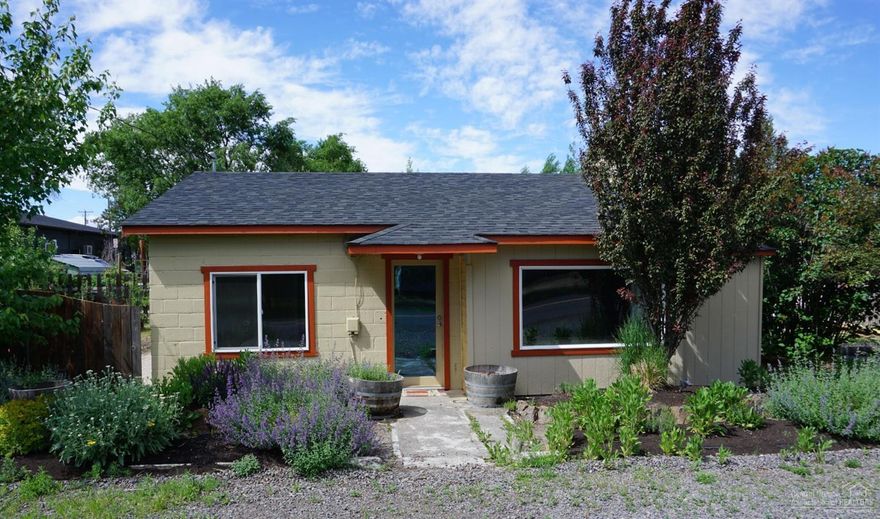 Incredible investment property! Residential property on a commercially zoned lot. Perfect for a rental, studio, office, or your new home! Amazing location in the center of downtown Tumalo. Brand new Jen-Weld windows throughout along with new kitchen cabinets and quartz counter tops. Owner will leave all furnishings if desired so its ready to go as a short term rental. Includes 4 raised garden beds. Beautiful mature perennial landscape makes this property low maintenance. Price includes permit and hookup fees to new sewer system. Located a few blocks from the Deschutes River. SO much potential!