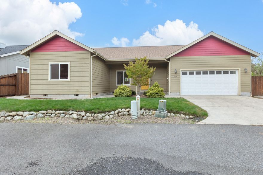 Lovely 3 bedroom 2 bathroom home built by Valerian Homes in 2016! This home is off of a private lane and does NOT face G St.  Open concept living with spacious vaulted living room, beautiful wood laminate flooring, granite kitchen countertops with a breakfast bar on the island, a fabulous pantry, generous laundry room with large sink, and finished attached 2 car garage! Split floor plan with primary suite that includes ample walk-in closet, double bathroom vanity with granite countertops, and custom tile shower.  Exterior features include covered front porch/entry and covered patio (plumbed for your gas BBQ) off the dining area, both with stamped concrete.  Low maintenance yard with in-ground sprinklers.  New Interior paint maintains that ''New Home Feel''!  Great location is close to downtown, shopping, parks, medical services, and more.  Move-in ready! Back on Market- No Fault of the Property!