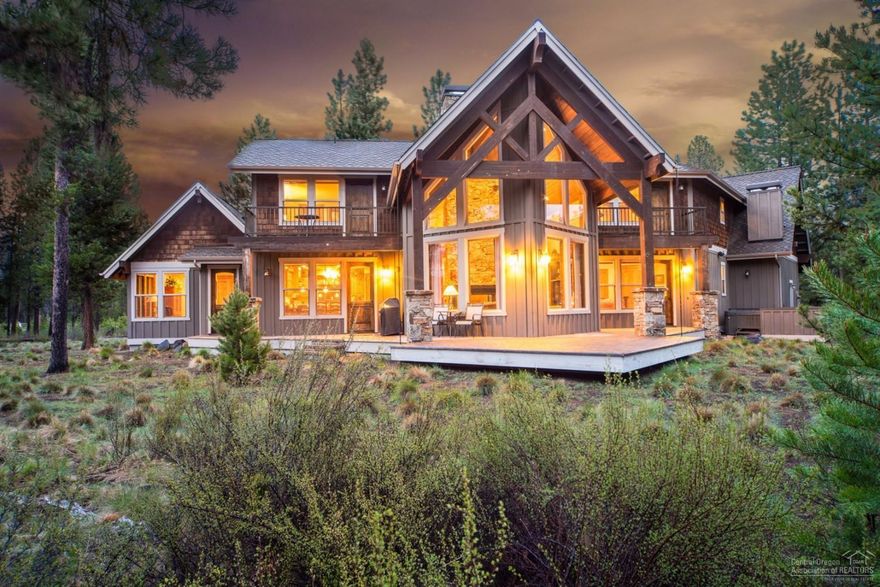 Wonderful location, wonderful design! Must see this lodge style home with an open 'campfire' fireplace, cathedral ceilings, 4 master suites, bonus room and complete furniture package! Chef's kitchen enjoys open design, sitting bar and Dacor appliances. Large corner lot provides excellent privacy plus views of Fireglass Lake and Caldera Creek from almost every room. Covered outdoor paver patio extends the living space. Tons of storage, 3 car garage. Lightly used, never been rented.