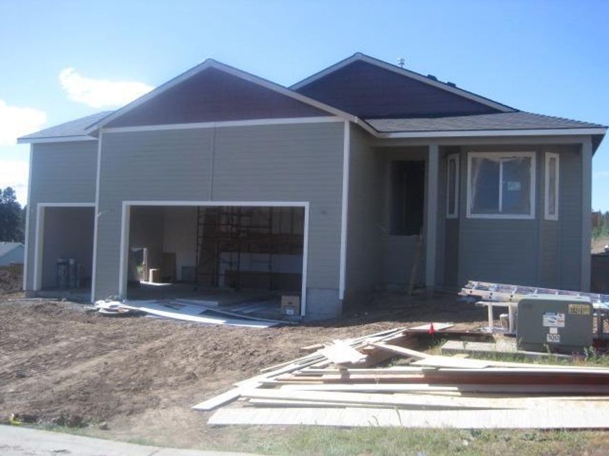 New Construction should be done middle of August.Three Car Garage,Custom Oak Cabinets,Formica countertops,Tile Flooring in bathrooms and laundry room, Carpet in all three bedrooms, Hard surface flooring through entry,living room, kitchen, dining, and family room and down hallway. Front yard landscaping with inground sprinklers, Backyard Fenced, Still time to add or change to customize but will have additional cost. One year contractor warranty.