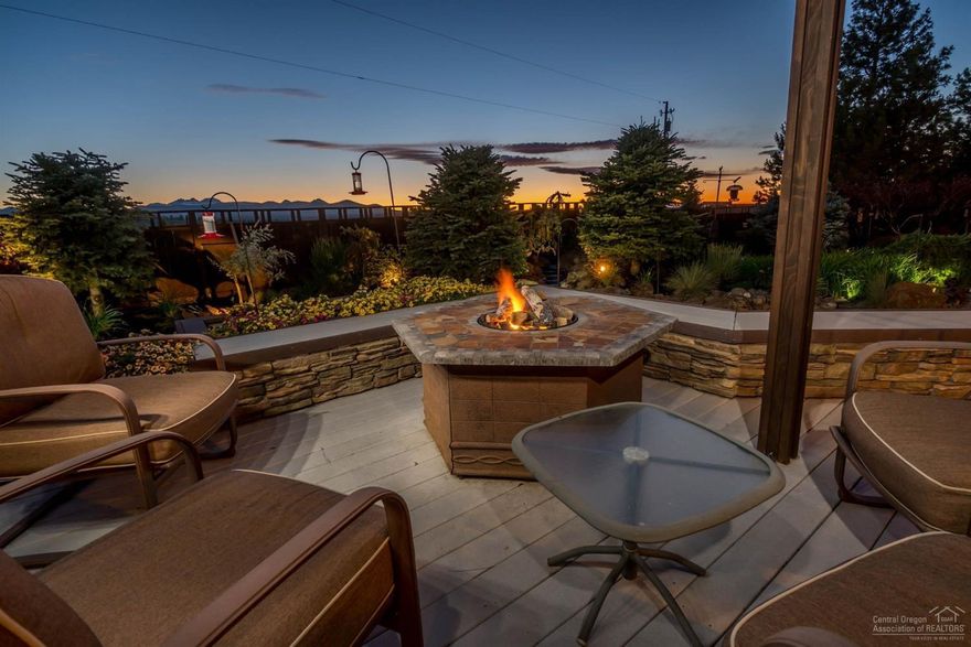 Wake up to welcoming Cascade mountain views from Mt. Bachelor to Hood. Prime location in the heart of Bend overlooking 14 acres of parkland offering privacy at its finest. New interior paint, driveway, paver paths and parking area.Wolf range, high end appliances. Exquisite finishes including Eucalyptus floors, granite, custom cabinetry, quality windows & trim. 2 masters w/one on main. Photo worthy landscape, 2 water features, wrap around decking. Room for lrg motor coach, vegetable garden & more. Epoxy coated garage, large shop. No HOA. Easy access to Mt. Bachelor!