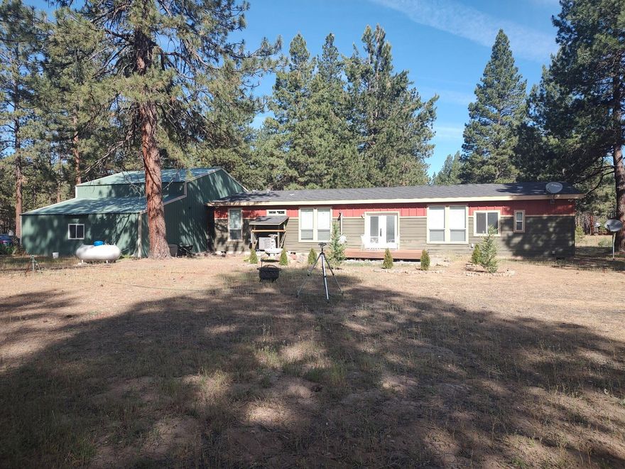 Nice 3 bedroom, 2 bath mobile home built in 2016 with a large shop, that sits nestled amongst 1.98 acres.