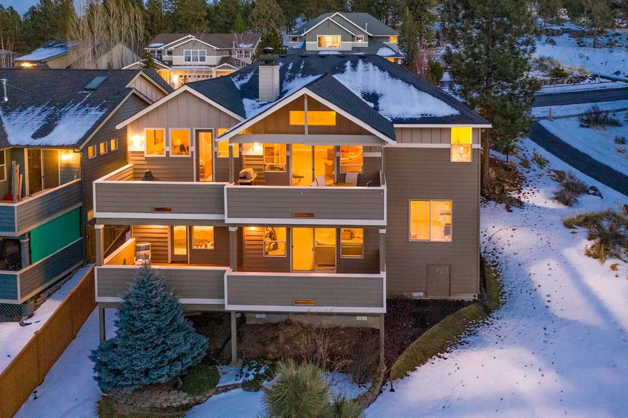 These 3300 plus square foot home rests in NW Bend on a large site bordered by Ponderosa Pines, and the Highlands Trail system out the front door which leads to World Class mountain biking within a mile, or downtown Bend and the Deschutes river frontage a mile the other direction. The neighborhood includes 2 private parks, and a 40-acre dog park, amongst nearly 80 acres of common grounds! Many customized finishes for this home, which are not found in the other surrounding homes. The custom wine cellar, bonus rooms, and covered decks with mountain views make this a very special residence.