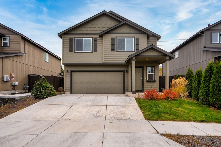 Live, work, and invest in Bend's vibrant east side! This modern Craftsman in Butler Crossing combines style, convenience, and smart ownership—just minutes from St. Charles Hospital, parks, and schools. Built in 2019, it offers 3 bedrooms, 2.5 baths, and a bright vaulted great room perfect for everyday living. The kitchen features a breakfast bar and ample storage, with washer, dryer, and blinds all included.
Though it backs to Butler Market Road, the home feels surprisingly private thanks to excellent insulation that minimizes road noise, along with a fully fenced yard enclosed by a 6-foot fence and low-maintenance landscaping—ideal for relaxing or entertaining. With no HOA and a location inside Bend's Opportunity Zone, this home offers both lifestyle and investment appeal.