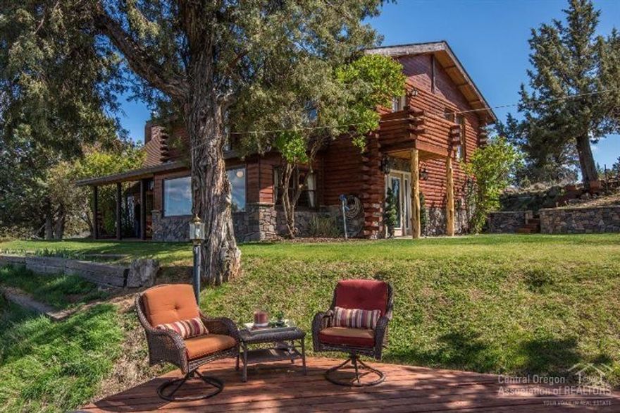 Exquisite, custom, log cabin style oasis on over 12 acres offers beautiful, panoramic views from the Cascade Mountains to Smith Rock. This spacious home offers pergo wood flooring throughout, granite kitchen and bathroom counters, and vaulted open beam living room with a loft and stone fireplace. Best of all, this horse property has a newly finished, matted two stall barn with foaling and grooming. This fenced and cross fenced property backs up to BLM on two sides! See attached amenities list.