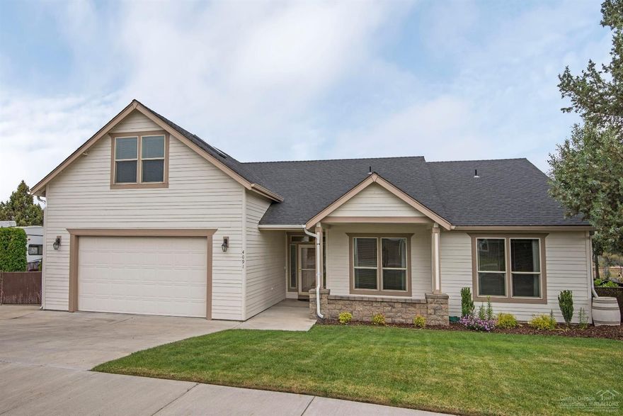 Beautiful home at The Greens at Redmond. Single level living with bonus over garage- has full bath, Open floor plan, granite solid counter tops, fireplace, RV parking, and golf cart garage. Low maintenance yard and seasonal canal frontage.