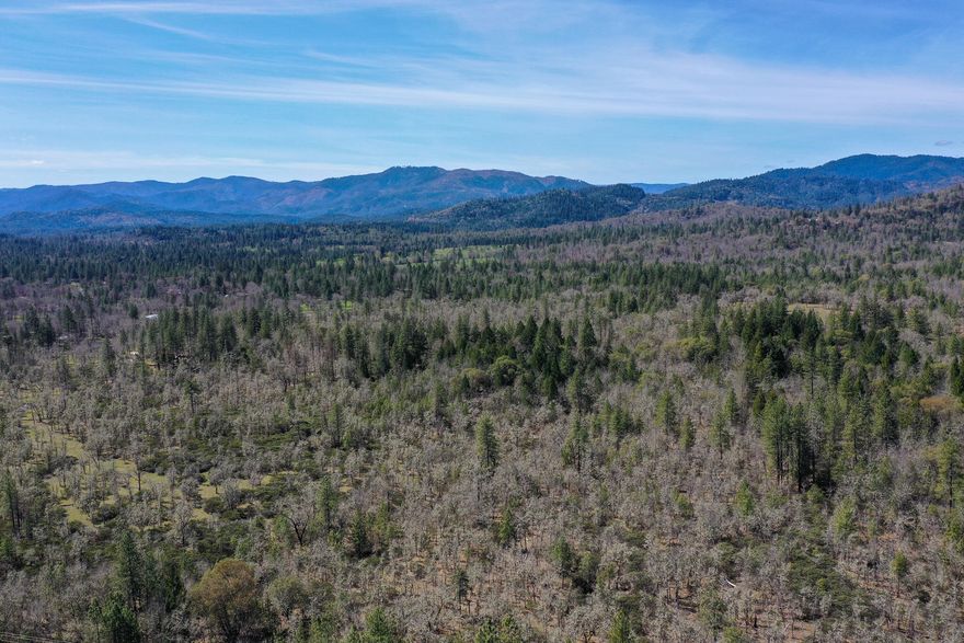 Please Do not trespass property. Beautiful nearly 3 acres with a creek running near the border of the property.  Livable mobile home while you build your new home, or obtain a construction loan. Enjoy the open spaces with beautiful trees bordering , offering privacy.  Zoned RR2.5.