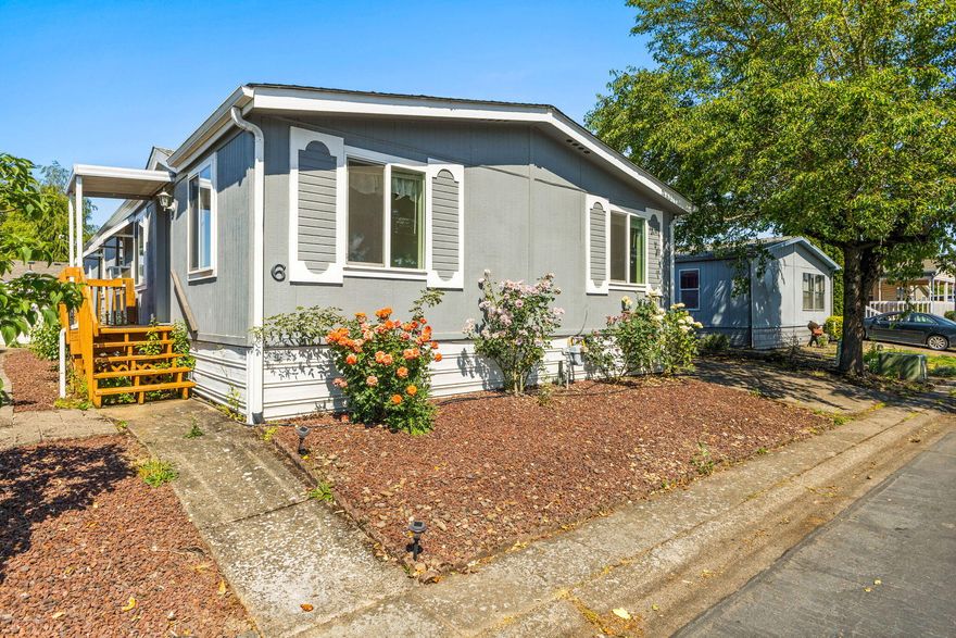 Spacious and versatile 3-bedroom manufactured home in a desirable 55+ community! This well-kept home features a large primary suite with en suite bath, plus a bonus room perfect for a home office or den. Enjoy the convenience of covered parking, three storage sheds, and plenty of space for hobbies or guests. Located in a quiet, well-maintained park close to shopping and services—this home is ready for you to move in and make it your own!