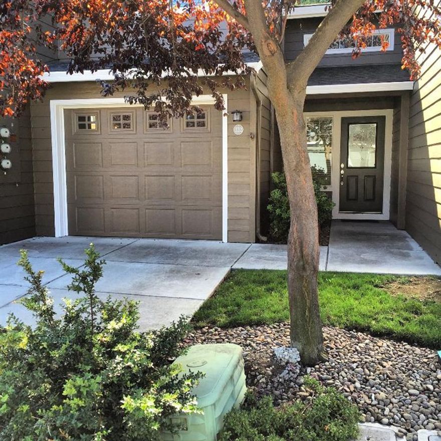 Charming Craftsman style townhome in quiet Central Point Community with its own private park! Conveniently located to Ashland, Medford, Rogue River, the Interstate and airport, this home features cathedral ceilings, nice touches like attractive hardwood banisters and curved arch and angles. Large Pantry. Half bath downstairs, private suite and laundry upstairs, shelving in garage and private patio with your own shade tree. Care free living!Stacked washer and dryer included. Home warranty provided.