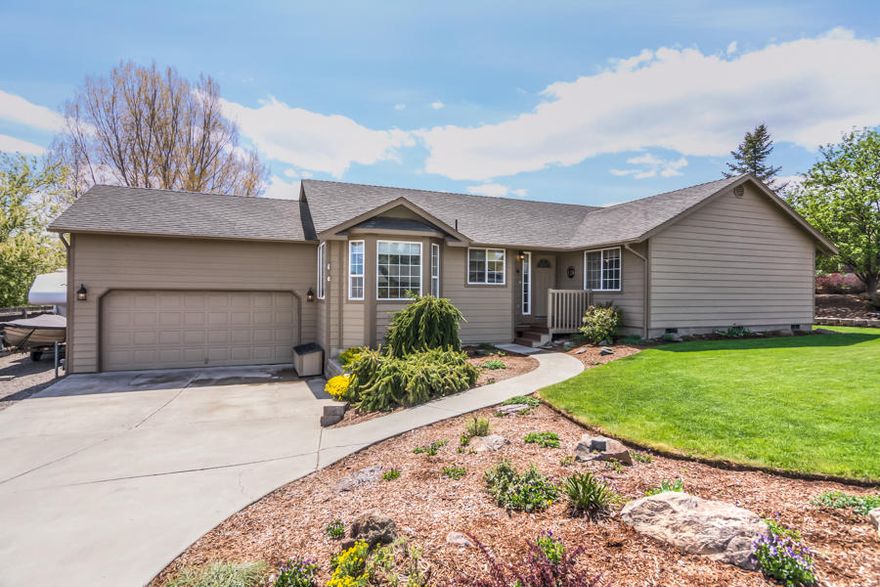 Pride of ownership shows throughout this lovely home.  You will enjoy the master suite with back yard access, a walk in closet and enclosed shower/toilet.  The two additional bedrooms have large closets, and the second full bath has been recently updated.  The kitchen is well appointed to include a closet pantry, extra seating at the breakfast bar, and great neighborhood views from the NE facing dining area.  The home has a heat pump with programmable thermostat, additional insulation has been added in the attic, garage loft storage, dog kennel, storage shed, easy RV parking, and the lot is beautifully landscaped.  With so many great features, this home is sure to please.  Don't pass this one by!